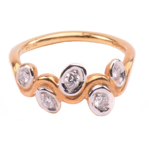 170 - A five stone diamond ring; the graduated round brilliant cut diamond in recessed bi-coloured 18 cara... 