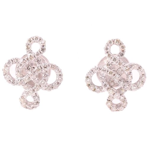 174 - A pair of diamond-set stud earrings of knot design, encrusted with brilliant-cut diamonds throughout... 