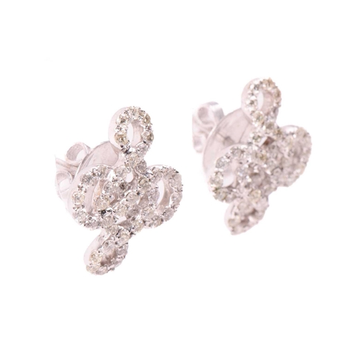 174 - A pair of diamond-set stud earrings of knot design, encrusted with brilliant-cut diamonds throughout... 