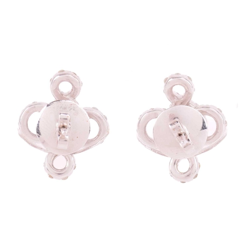174 - A pair of diamond-set stud earrings of knot design, encrusted with brilliant-cut diamonds throughout... 
