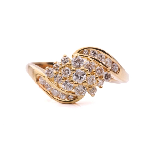 176 - A diamond crossover cluster ring, set with a central cluster of round brilliant cut diamonds between... 