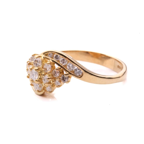 176 - A diamond crossover cluster ring, set with a central cluster of round brilliant cut diamonds between... 