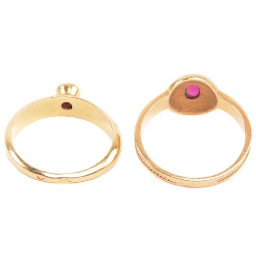 180 - A ruby ring, set with an oval cabochon ruby to the centre, with filigree decoration surround and fur... 