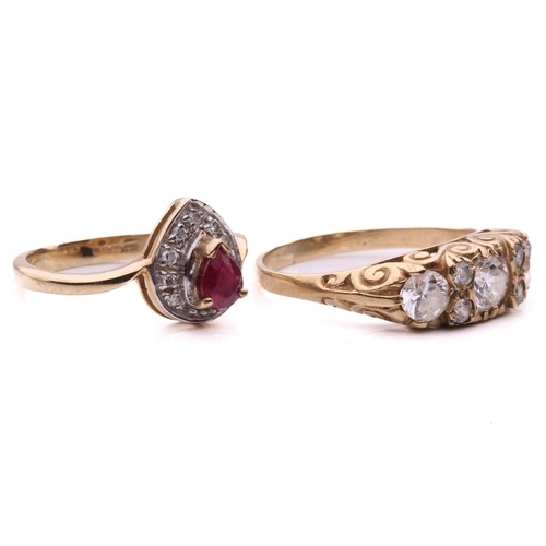 19 - Two gem-set dress rings; the ruby and diamond cluster ring, set with a pear shape ruby surrounded by... 