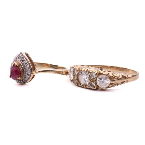 19 - Two gem-set dress rings; the ruby and diamond cluster ring, set with a pear shape ruby surrounded by... 