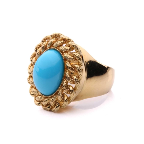 2 - A turquoise dress ring, centred with an oval turquoise cabochon, collet set within a textured curb l... 