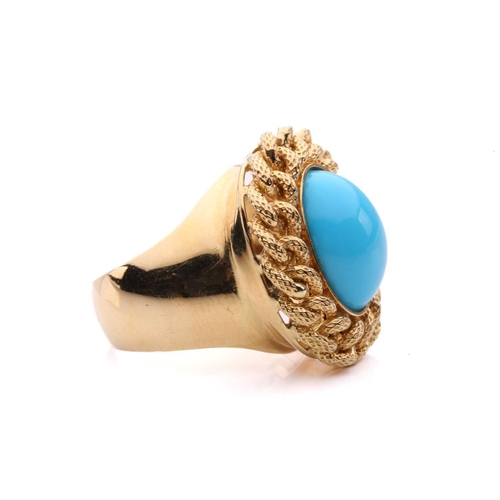 2 - A turquoise dress ring, centred with an oval turquoise cabochon, collet set within a textured curb l... 