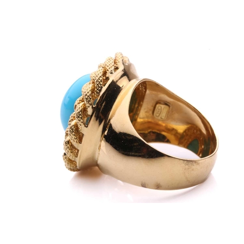 2 - A turquoise dress ring, centred with an oval turquoise cabochon, collet set within a textured curb l... 
