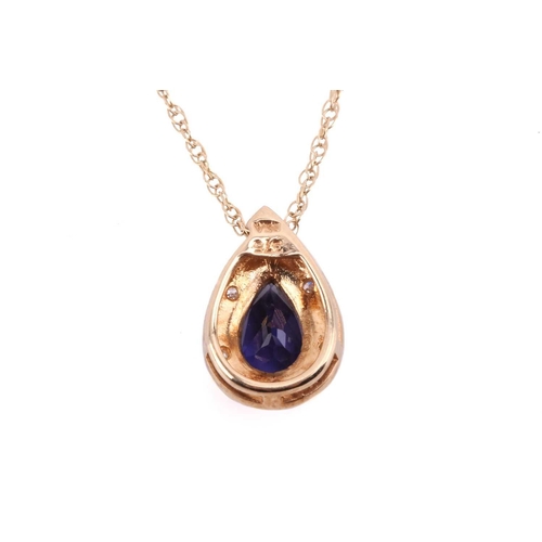 20 - An iolite and diamond drop shape pendant, the central pear shape iolite measuring 7.8mm x 5.6mm, wit... 