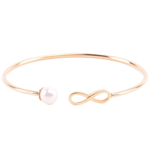 22 - A cultured pearl and CZ ring and other items with imitation pearls; the ring centred with a 7.2 mm r... 