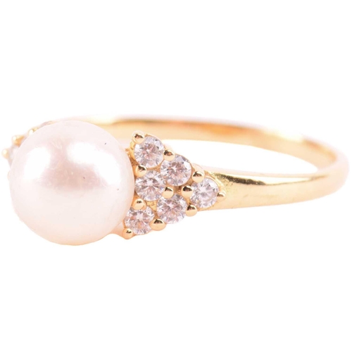 22 - A cultured pearl and CZ ring and other items with imitation pearls; the ring centred with a 7.2 mm r... 