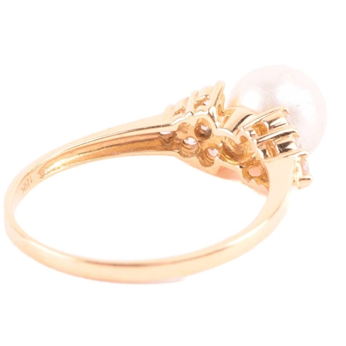 22 - A cultured pearl and CZ ring and other items with imitation pearls; the ring centred with a 7.2 mm r... 