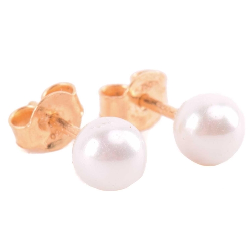 22 - A cultured pearl and CZ ring and other items with imitation pearls; the ring centred with a 7.2 mm r... 