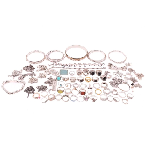 242 - A collection of jewellery in white metal, including ingot, cross, St Christopher, quartz pendants, e... 