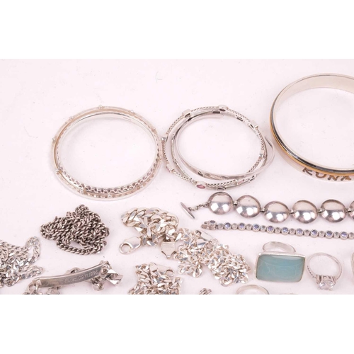 242 - A collection of jewellery in white metal, including ingot, cross, St Christopher, quartz pendants, e... 
