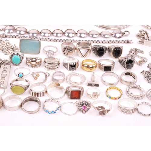 242 - A collection of jewellery in white metal, including ingot, cross, St Christopher, quartz pendants, e... 