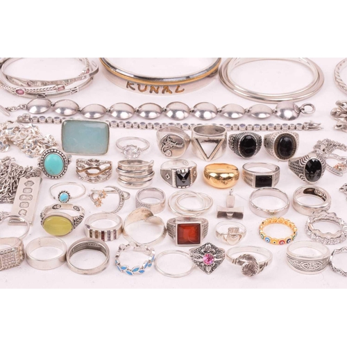 242 - A collection of jewellery in white metal, including ingot, cross, St Christopher, quartz pendants, e... 