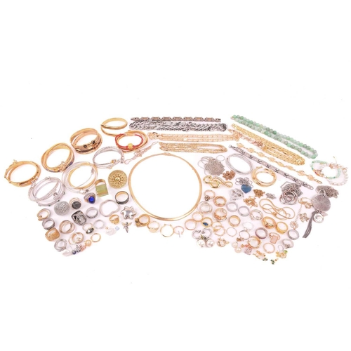 247 - A large collection of jewellery in base metal, including pendants, earrings and rings, and further b... 