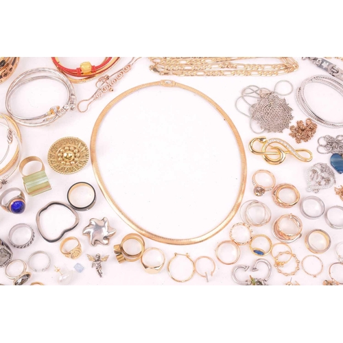 247 - A large collection of jewellery in base metal, including pendants, earrings and rings, and further b... 