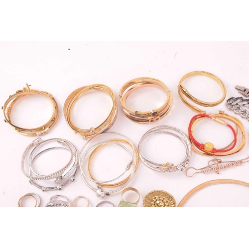 247 - A large collection of jewellery in base metal, including pendants, earrings and rings, and further b... 