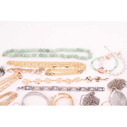 247 - A large collection of jewellery in base metal, including pendants, earrings and rings, and further b... 