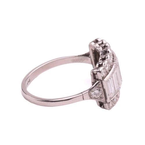 249 - A diamond ring, set with a central row of baguette cut diamonds between rows of round brilliant cut ... 