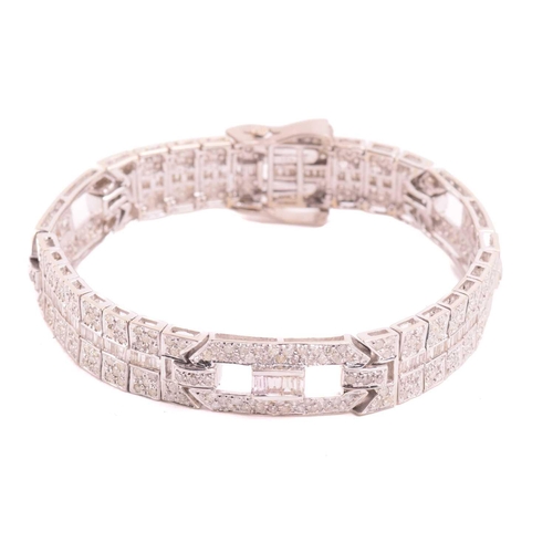 250 - A diamond bracelet, set with round brilliant cut and baguette cut diamonds with a total estimated di... 