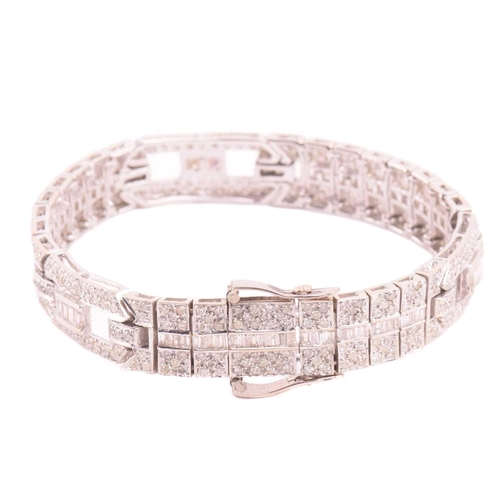 250 - A diamond bracelet, set with round brilliant cut and baguette cut diamonds with a total estimated di... 