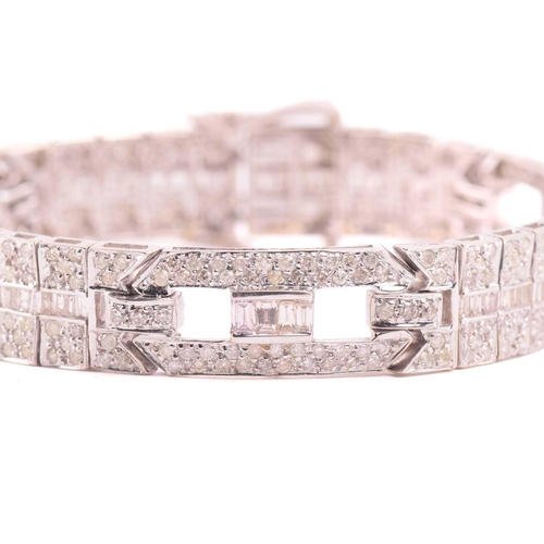 250 - A diamond bracelet, set with round brilliant cut and baguette cut diamonds with a total estimated di... 