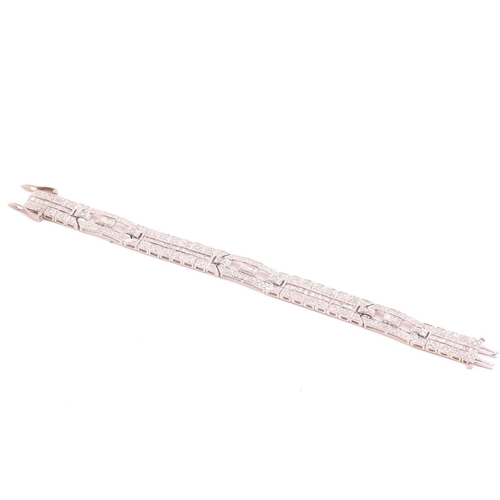 250 - A diamond bracelet, set with round brilliant cut and baguette cut diamonds with a total estimated di... 