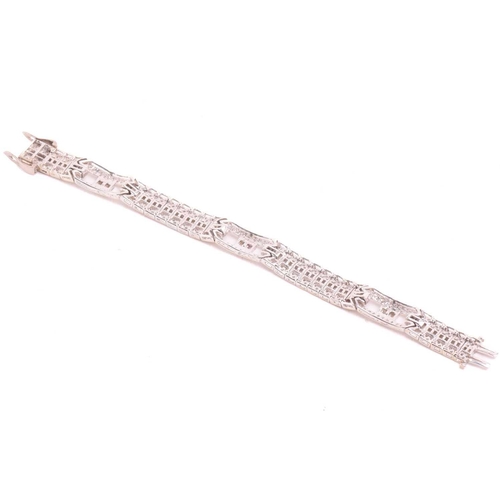 250 - A diamond bracelet, set with round brilliant cut and baguette cut diamonds with a total estimated di... 