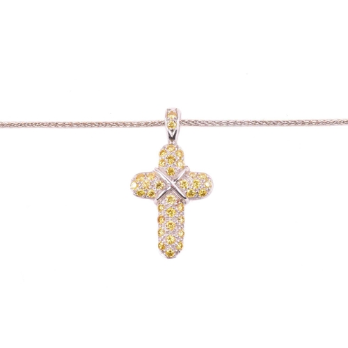 252 - A yellow diamond cross pendant, set with round brilliant cut yellow diamonds with a total diamond we... 