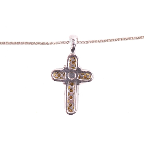252 - A yellow diamond cross pendant, set with round brilliant cut yellow diamonds with a total diamond we... 