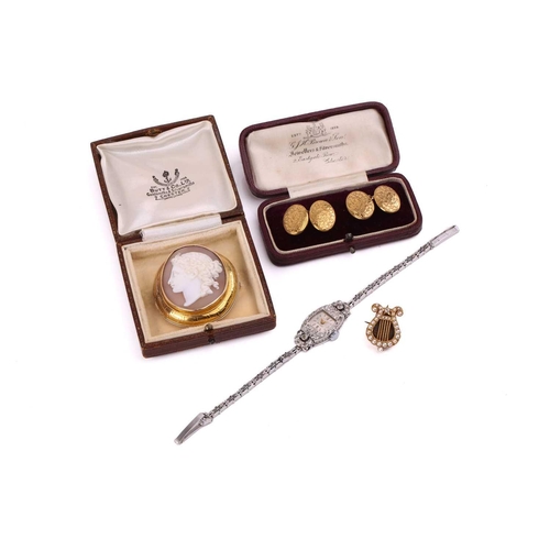 253 - A platinum and diamond cocktail watch, the tonneau-shaped case set with mixed old cut diamonds, mech... 
