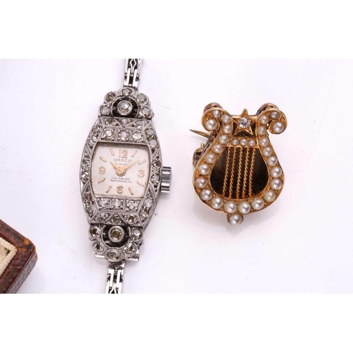 253 - A platinum and diamond cocktail watch, the tonneau-shaped case set with mixed old cut diamonds, mech... 