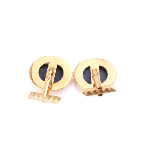 255 - A pair of lapis lazuli cufflinks with filigree surround, marked 'Italy 18k', a lapis lazuli signet r... 