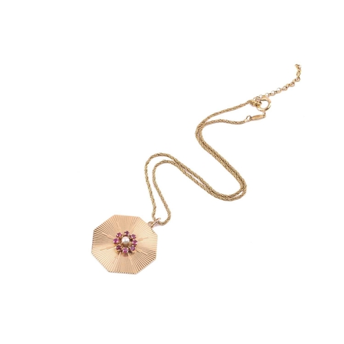 257 - A ruby and pearl cluster pendant on chain, the octagonal pendant centred with a ruby and pearl clust... 