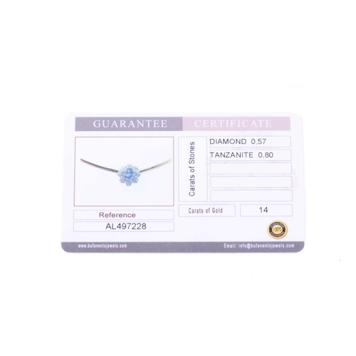 26 - A tanzanite and diamond cluster necklace, centred with an oval-cut tanzanite of 7.1 x 5.1 mm, within... 