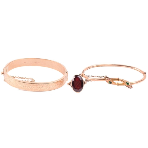 262 - A Victorian snake bangle set with paste, with an inner diameter of 6.4cm, a bangle with engraved des... 