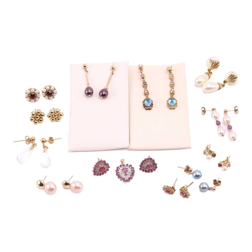 264 - Twelve pairs of earrings and a ruby set pendant. The first pair of stud earrings comprise a heart sh... 