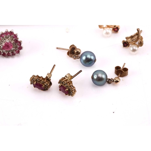 264 - Twelve pairs of earrings and a ruby set pendant. The first pair of stud earrings comprise a heart sh... 