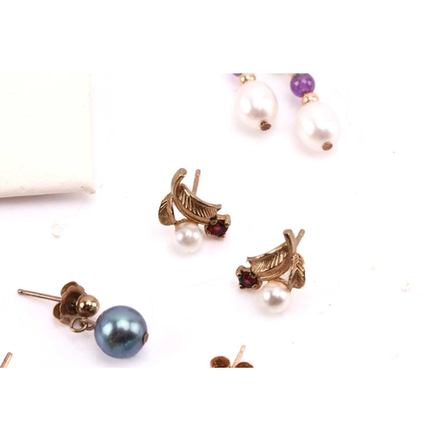 264 - Twelve pairs of earrings and a ruby set pendant. The first pair of stud earrings comprise a heart sh... 