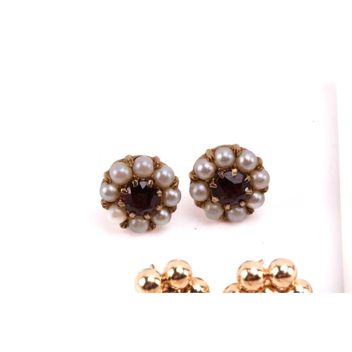 264 - Twelve pairs of earrings and a ruby set pendant. The first pair of stud earrings comprise a heart sh... 