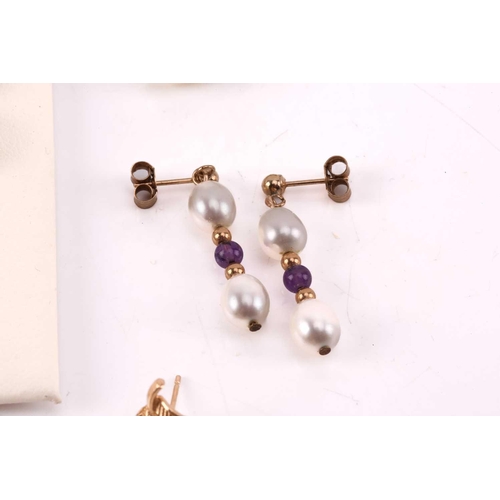 264 - Twelve pairs of earrings and a ruby set pendant. The first pair of stud earrings comprise a heart sh... 