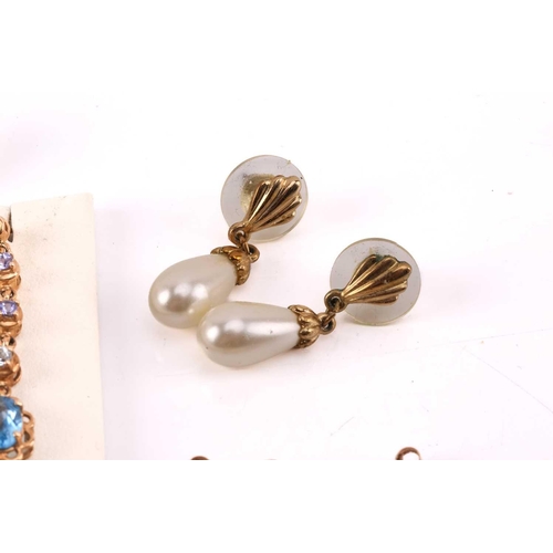 264 - Twelve pairs of earrings and a ruby set pendant. The first pair of stud earrings comprise a heart sh... 