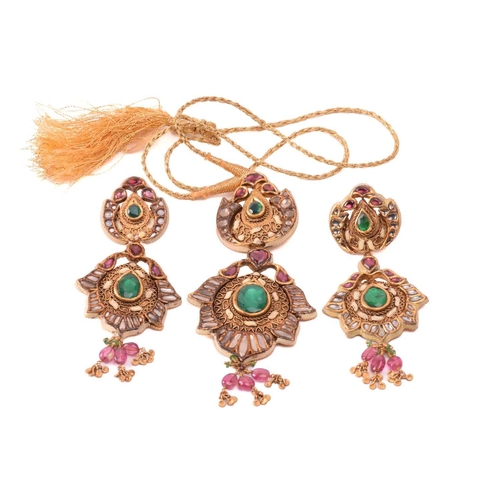 265 - An Indian polychromatic gem-set necklace and earrings ensuite; the pendant with a cream-coloured ena... 