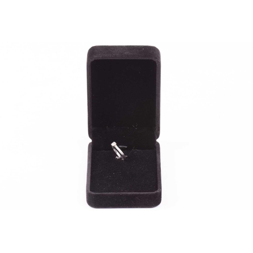 27 - A single stone diamond ring, the round brilliant cut diamond in simple four claw mount, with diamond... 