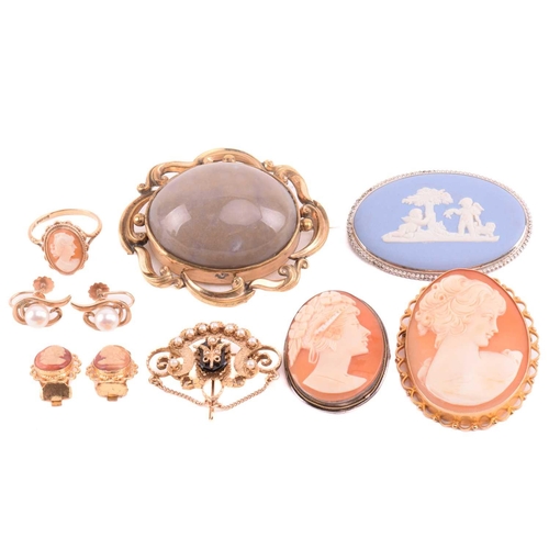 270 - An onyx and seed pearl brooch with a scrolling foliate design, marked 14k to the reverse, an oval sh... 