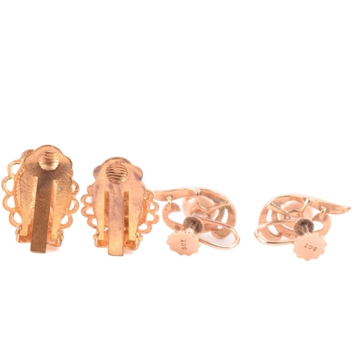 270 - An onyx and seed pearl brooch with a scrolling foliate design, marked 14k to the reverse, an oval sh... 