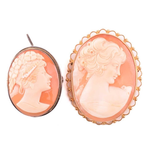 270 - An onyx and seed pearl brooch with a scrolling foliate design, marked 14k to the reverse, an oval sh... 